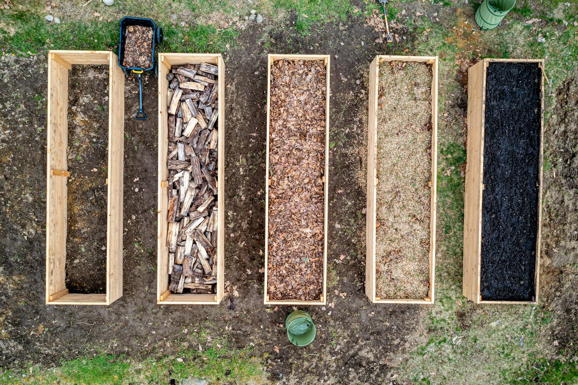 wooden containers with wood chips sawdust firewood and charcoal