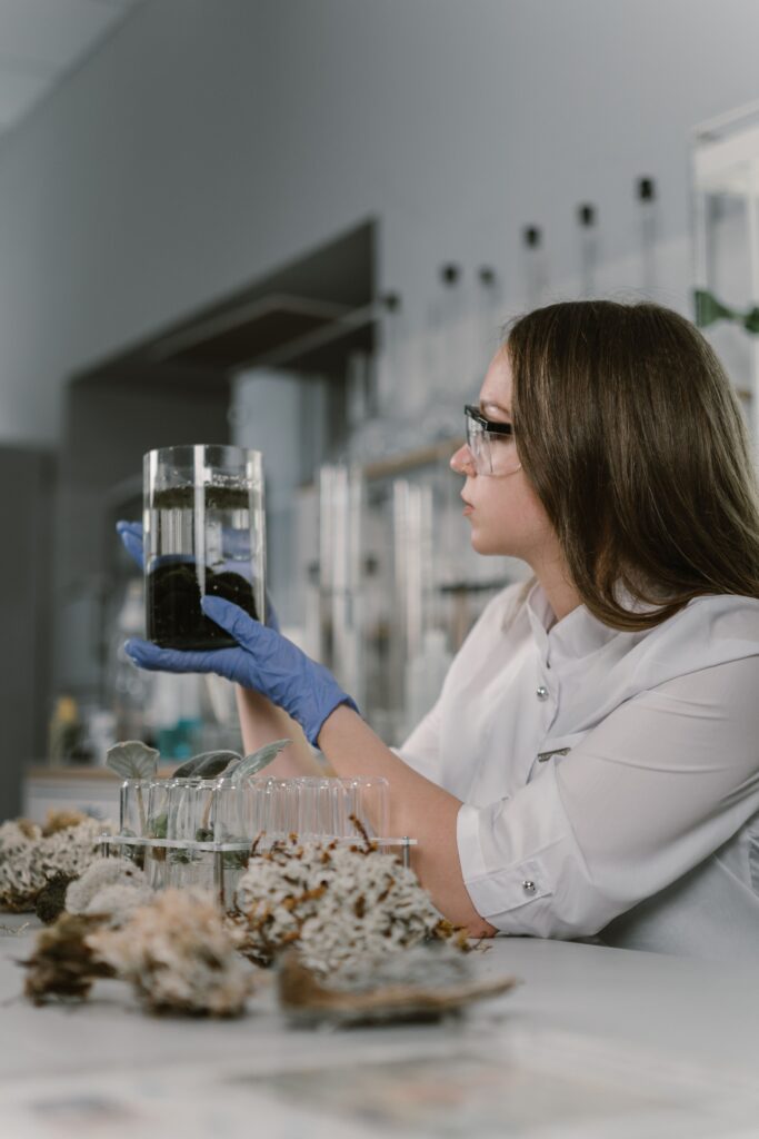 A researcher analyzes a soil sample in a lab